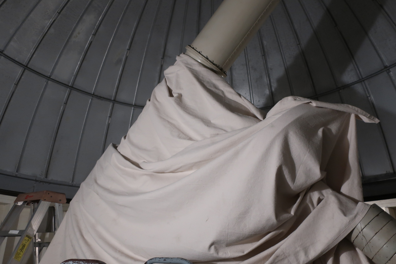 the telescope with the dust cover on and in a stored position